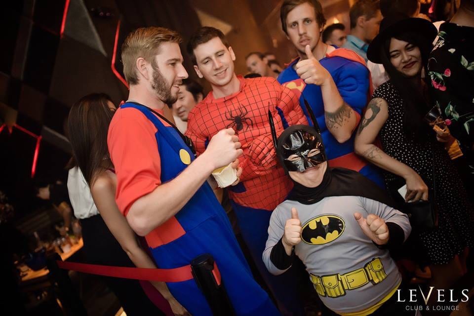 Little person strippers at a night club in a batman costume